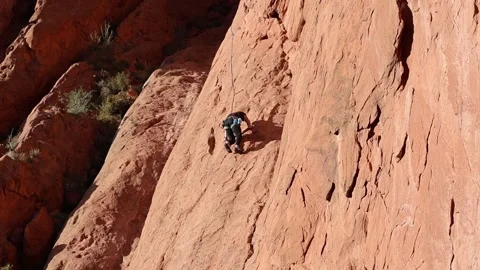 Climber on Red Rock Formations in Garden of the Gods Stock Footage 338421778