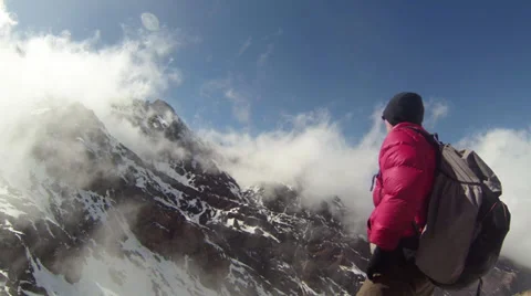 Climber Rests Amid The Clouds Stock Footage 36595551