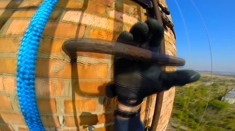 Climber rises on factory chimneys Video stock 42417405