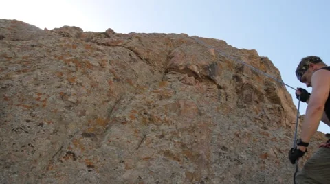 Climber rises on the rock Stock Footage 63213294