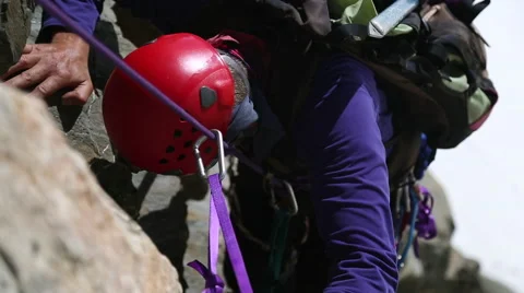 Climber on a rock face Stock Footage 55539461
