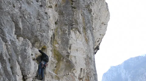 Climber on rock wall Stock Footage 23724469