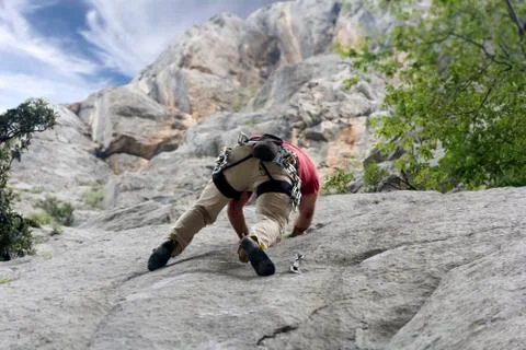 Climber on the rock wall Stock Photos