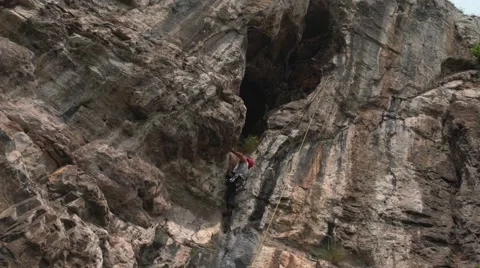 Climber on the Rocks Ropes 4K Stock Footage 64201745