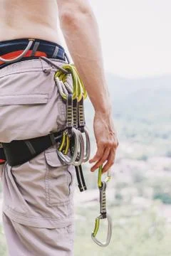 Climber standing with quickdraw. Stock Photos