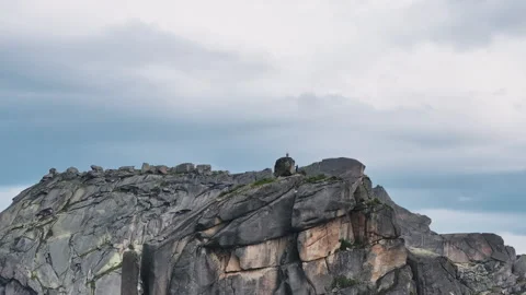 Climber standing on the top of a mountain Stock Footage 300915530