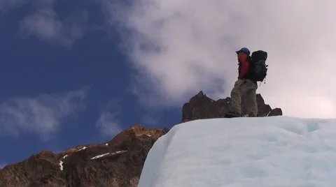 Climber Standing At The Top of Mountain HD Video stock 40716352