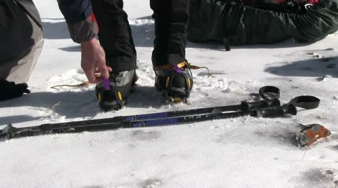 Climber taking crampons Stock Footage 42357722