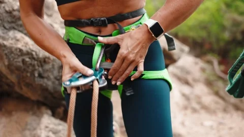 Climber Threads Rope Through Belay Device on Harness Stock Footage 346496097