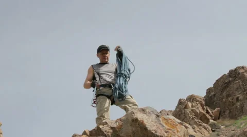 The climber throws down the rope 스톡 동영상 62389436