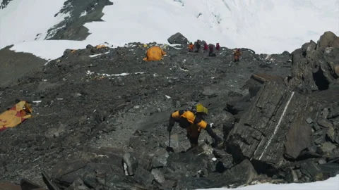 Climber trekking on dangerous rocky terrain on Mount Everest Stock Footage 331263243