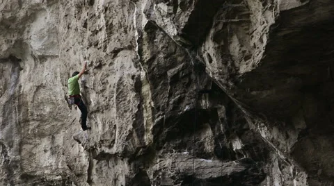 Climber tries difficult move then gives up Stock Footage 43811906