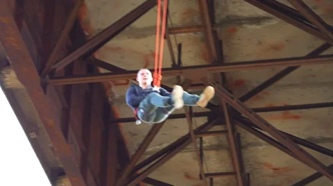 Climber turns going down on the rope Stock Footage 60442913