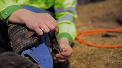 Climber unfasten claws for climbing Stock Footage 97358929