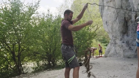 Climber untying the tangled rope Stock Footage 94590820