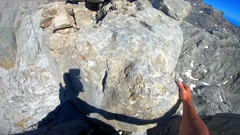 A climber walking along a very high ridge in peaks of europe. dizzying and Stock Footage 208317703