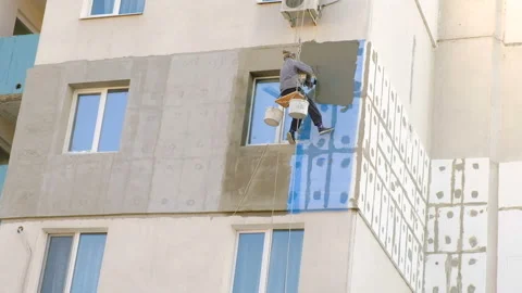 Climber Work On The Building. The Insulation Of Facades Video stock 99245674
