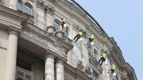 Climber Workers renovating the facade of an old building in the center of Moscow Stock Footage 65288402