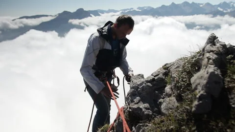 Climber working with equipment in the mountains. Stock Footage 97767439