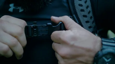 Climber zips up the lock of the backpack Stock-Footage 138691087