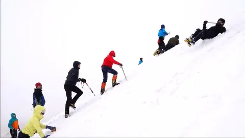 Climbers are trained to fall on the mountain. Motivation. Success. Stock-Footage 69100080