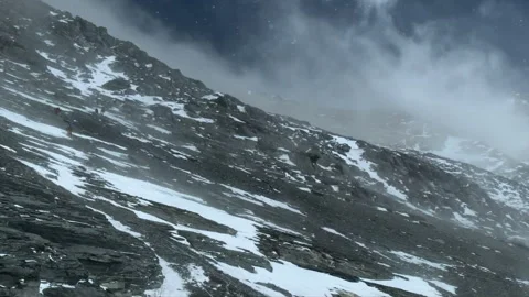 Climbers ascending the perilous slopes of Mount Everest Stock Footage 331263309