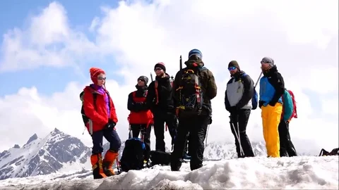 Climbers on the background of mountains and clouds. Success. Motivation. Stock Footage 69101792