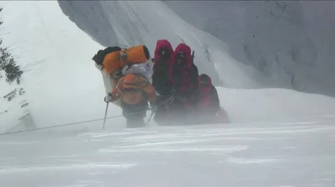 Climbers battered by strong winds Stock Footage 22220894