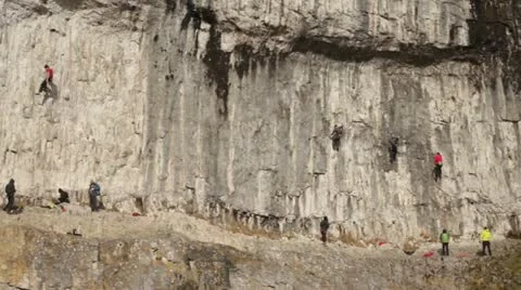Climbers on Cliff face Stock Footage 22283799