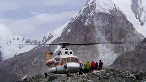 Climbers Getting Into The Helicopter Stock Footage 159655603