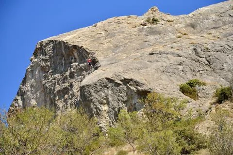 Climbers practicing on the cliff Stock Photos