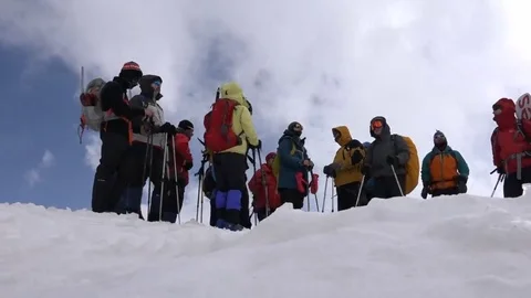 Climbers preparing to climb the mountain. Motivation. Stock Footage 69102375