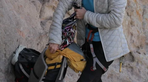 Climbers put the gear in the backpack Stock Footage 61752066