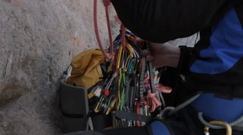 Climbers put the gear in the backpack Stock Footage 61752530