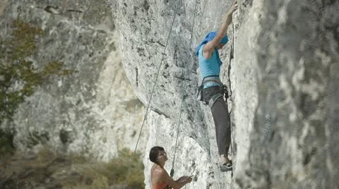 Climbers on a rock Stock Footage 12396472