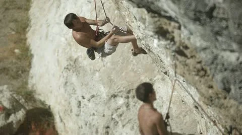 Climbers on a rock Stock Footage 12396627