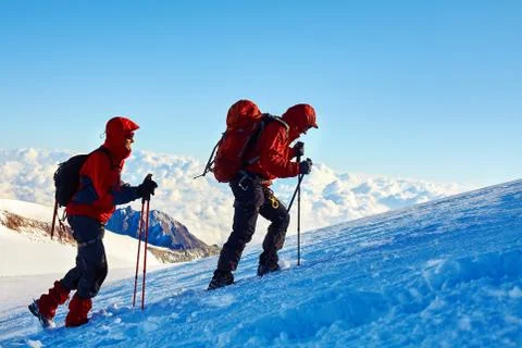 Climbers at the top of a pass Stock Photos