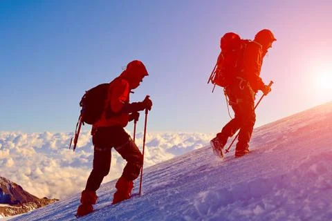 Climbers at the top of a pass Stock Photos