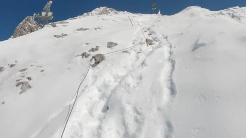 Climbing alpine mountain in the snow high elevation - Zugspitze extreme POV Stock Footage 161594237