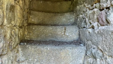 Climbing a bell tower through a narrow stone corridor 스톡 동영상 293302346