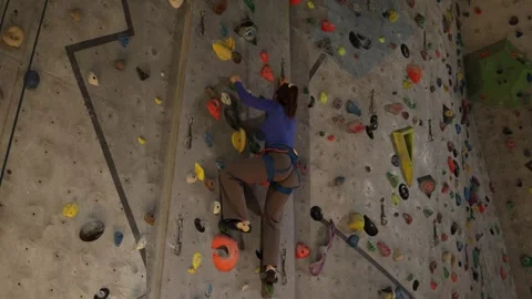 Climbing coach practices on wall Stock Footage 339287843