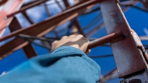 Climbing a communication tower with a view from first-person perspective Stock Photos