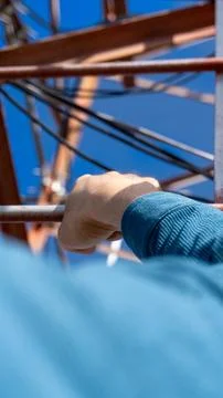 Climbing a communication tower with a view from first-person perspective Stock Photos