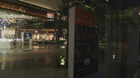 Climbing up on a crystal elevator on a big modern shopping mall Video stock 51628207