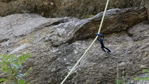 Climbing equipment, proven rope through climbing lock on the wall Stock Footage 80972002