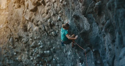 Climbing in golden light Stock Footage 115898953