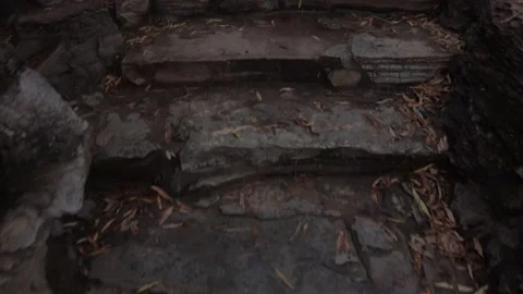 Climbing up a hill on stone steps on a rainy day, gimbal shot Video stock 136814914