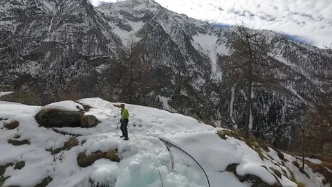Climbing a ice waterfalls Stock Footage 77952365