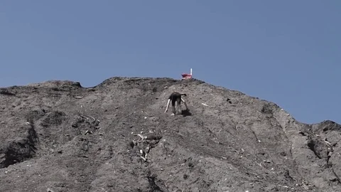 Climbing a mountain with a beautiful view Video stock 73384997