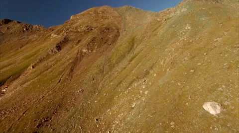 Climbing up by the mountain slope in the Alps Stock Footage 68015921